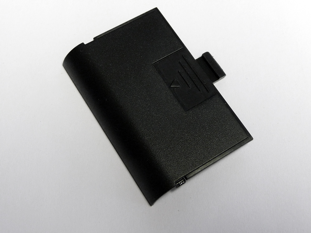 1553BATDOORBK — 1553 Battery Door Black