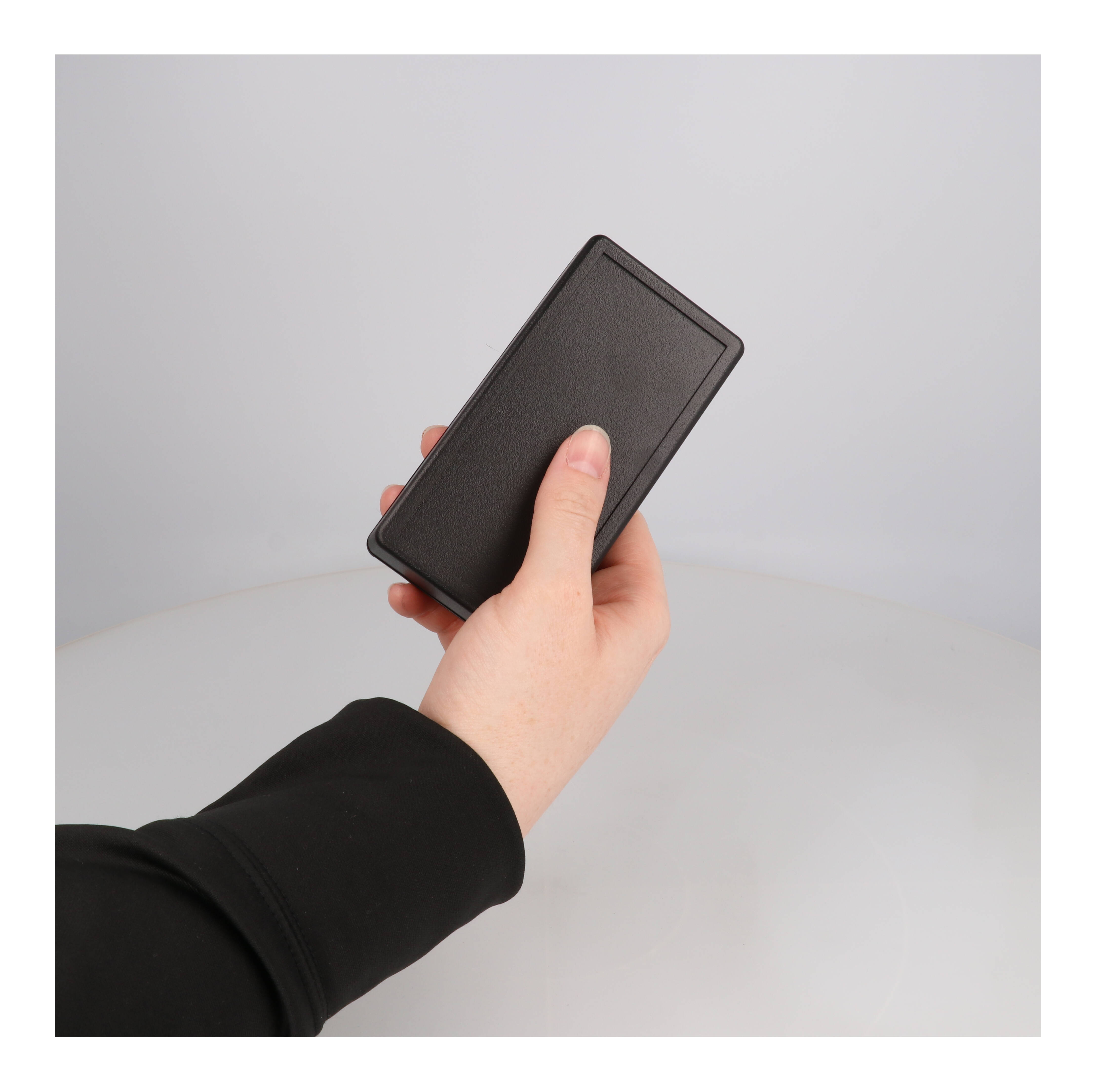 1599BBKBAT black flame retardant ABS handheld enclosure with battery door, 130 x 65 mm