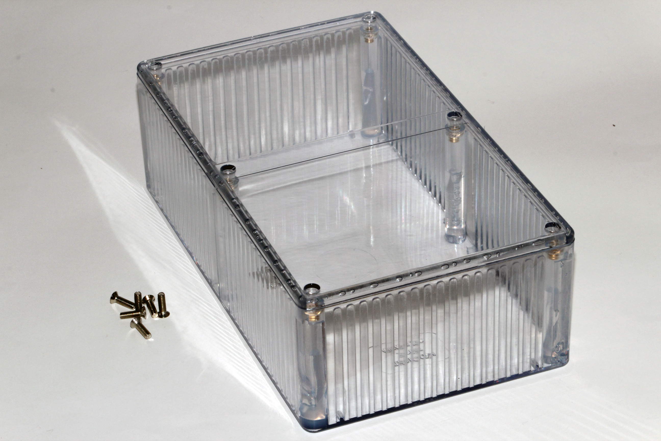 1591ETCL crystal clear polycarbonate enclosure showing internal card guides, 190 x 111 x 61 mm