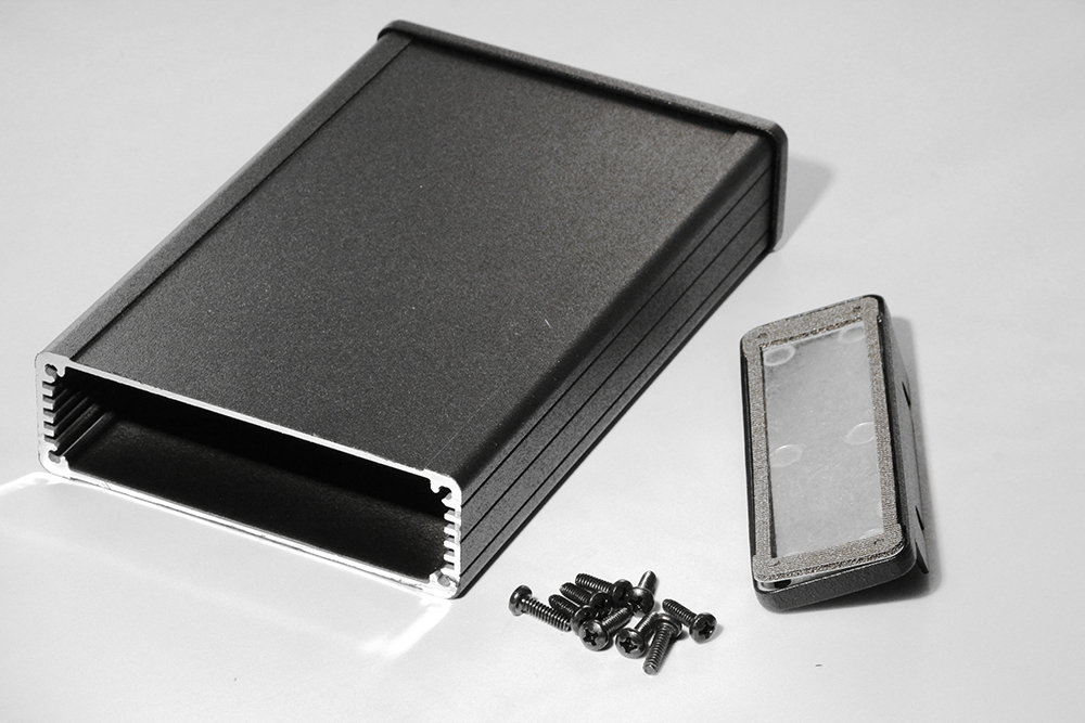 1457L1602EBK — black EMI/RFI shielded extruded aluminum enclosure flanged panels 6.30x4.09x1.26