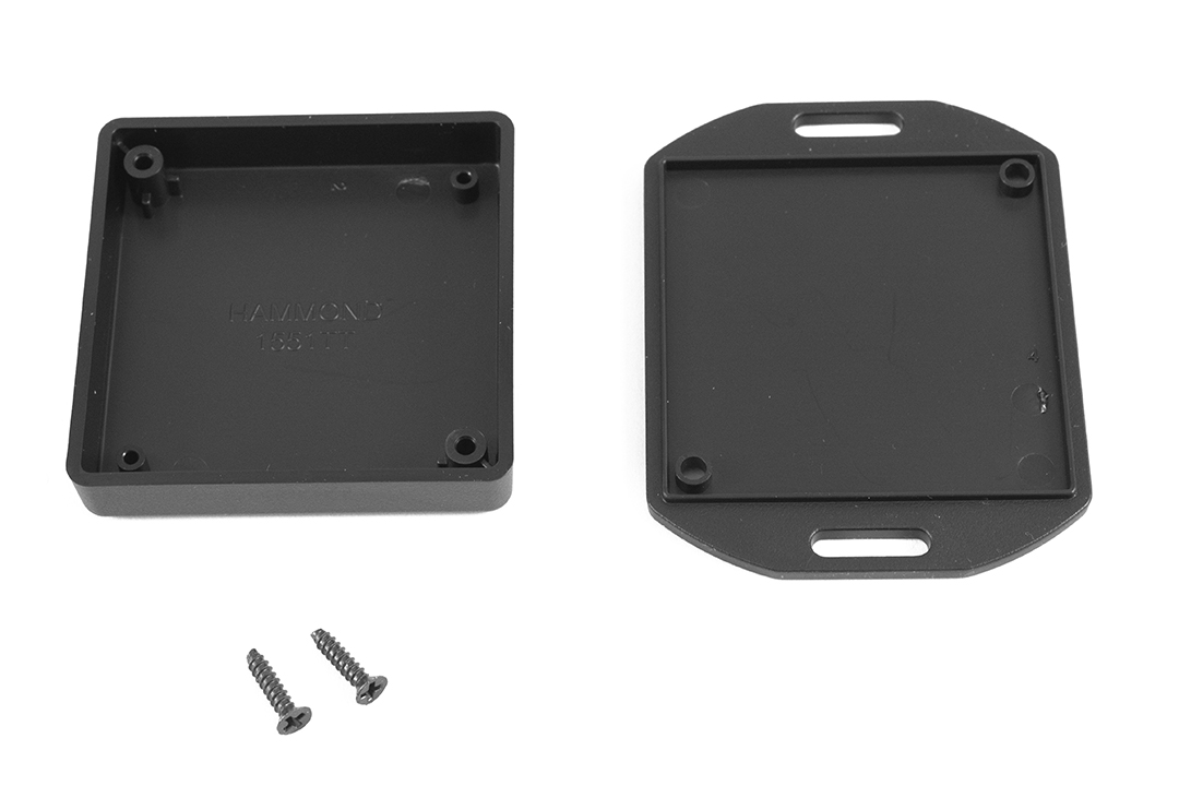 1551TTFLBK black ABS low-profile enclosure with flanged mounting lid, 60 x 60 x 15 mm