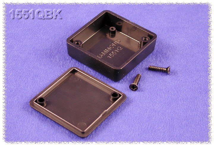 1551QBK black ABS plastic miniature enclosure, 40 x 40 x 15 mm, shown with lid and cover screws