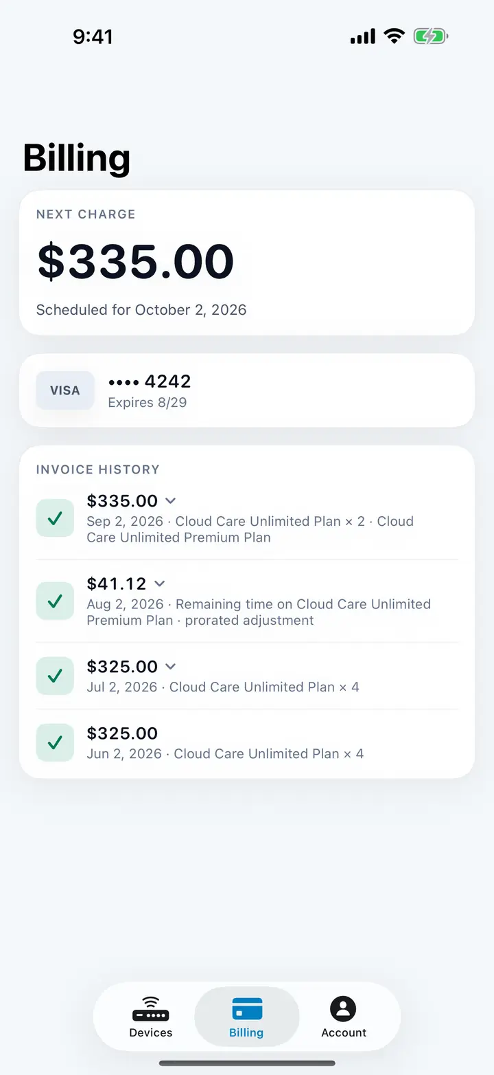 Billing screen: next charge $335.00, card on file, and invoice history itemised by plan