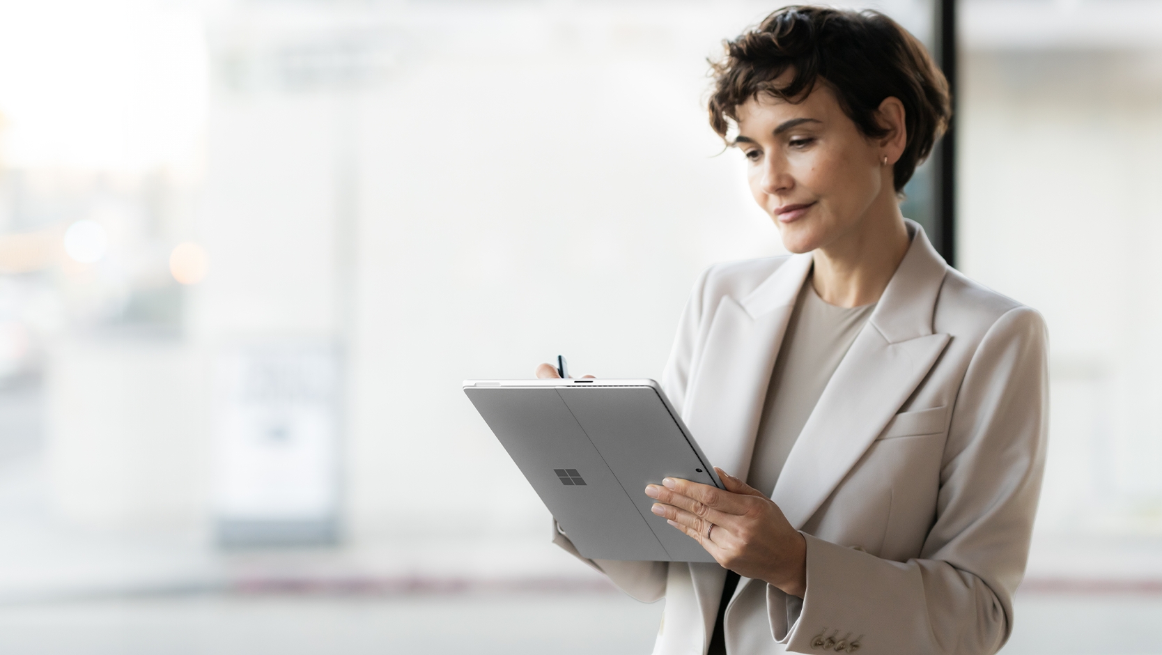 Microsoft Surface Pro 10 for Business 5G tablet in Platinum with its 13-inch PixelSense Flow touchscreen and built-in kickstand. — view 6