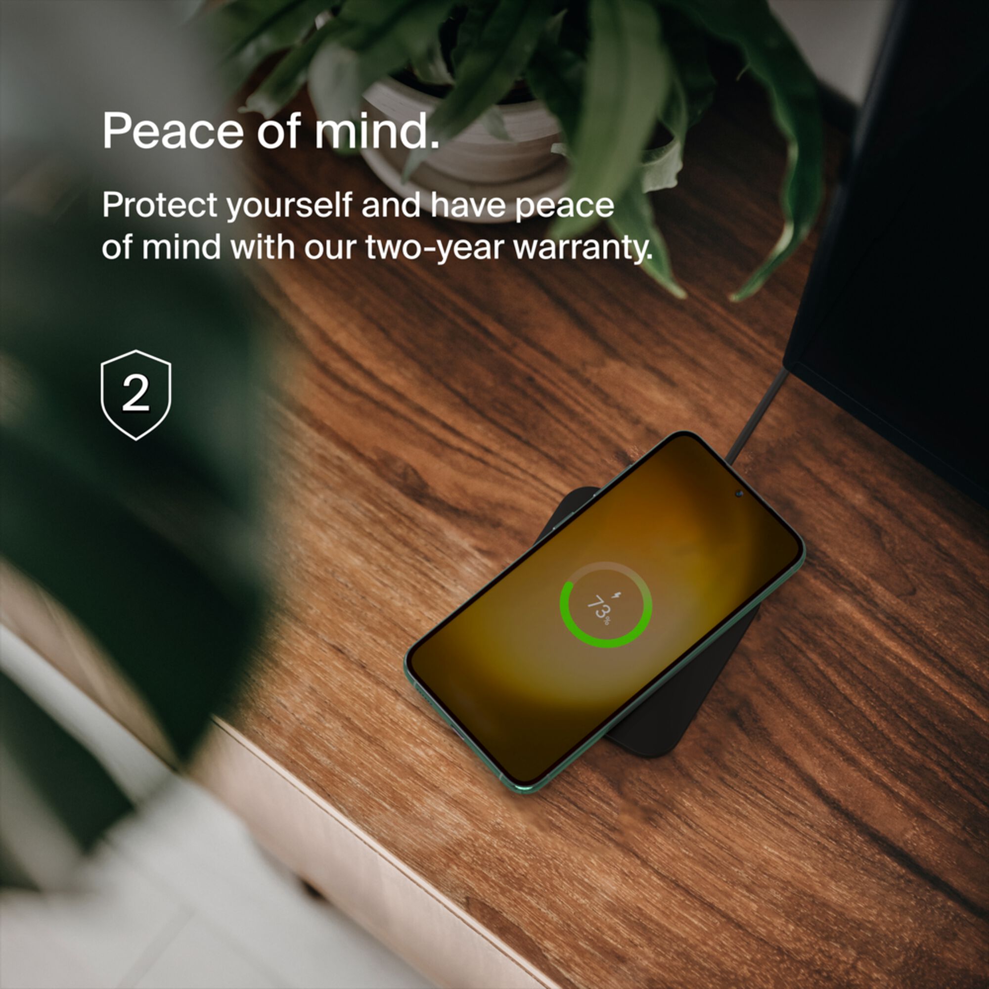 Belkin BoostCharge Pro Universal Easy Align 15W wireless charging pad in black with its attached USB-C power cable. — view 7