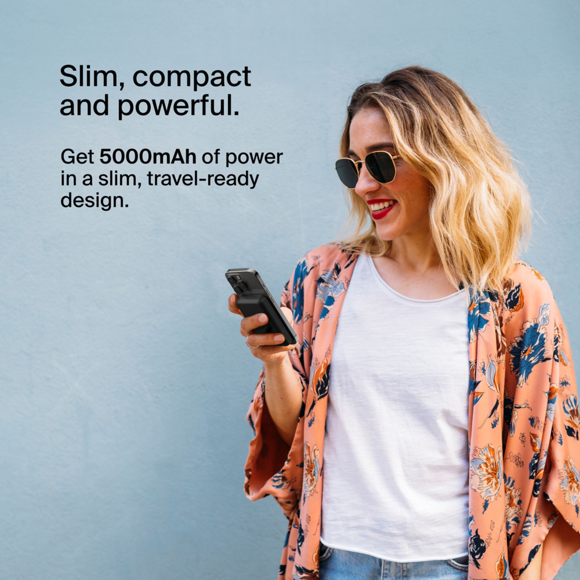 Black Belkin BoostCharge Magnetic Wireless Power Bank 5K with its metal fold-out kickstand extended. — view 3