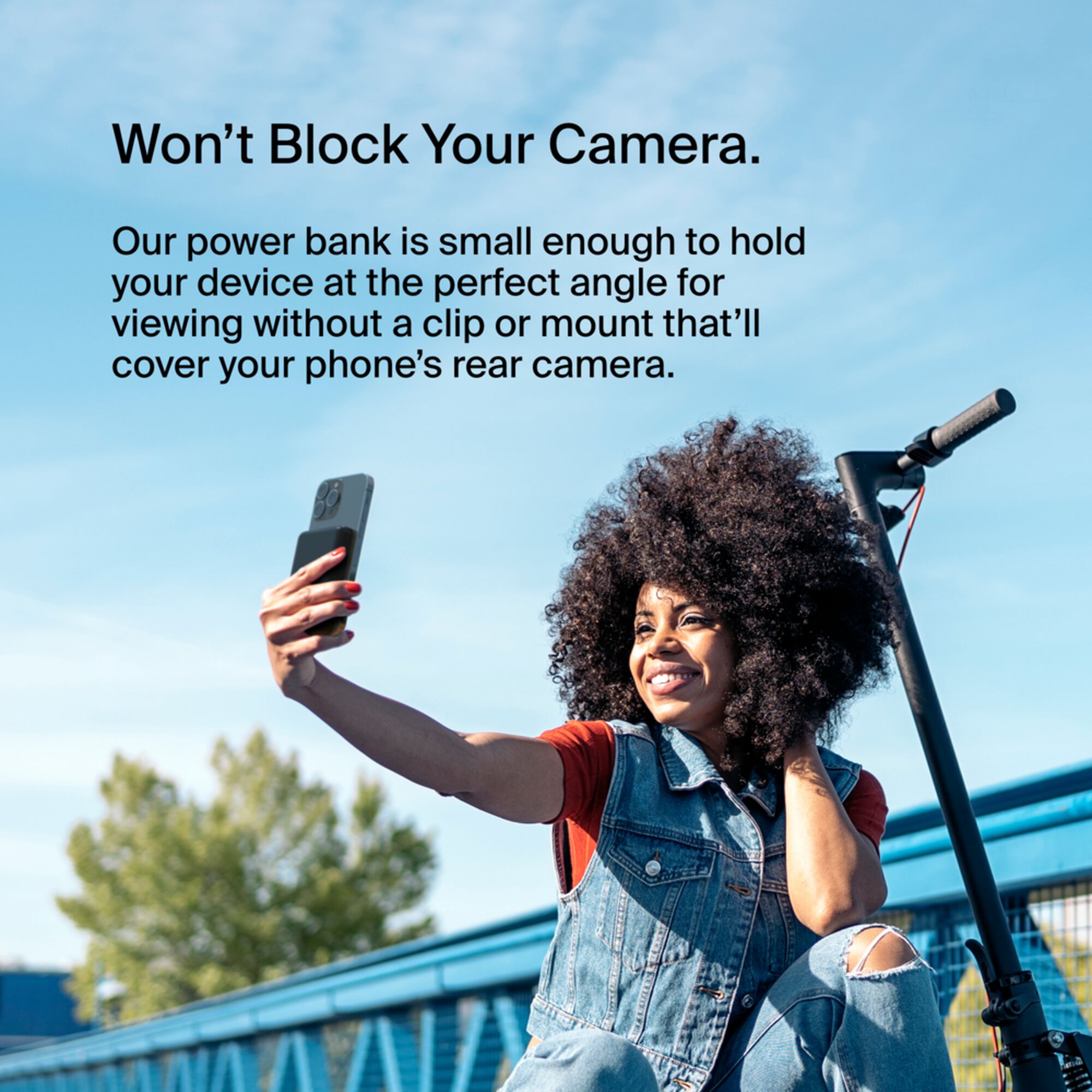 Black Belkin BoostCharge Magnetic Wireless Power Bank 5K with its metal fold-out kickstand extended. — view 7