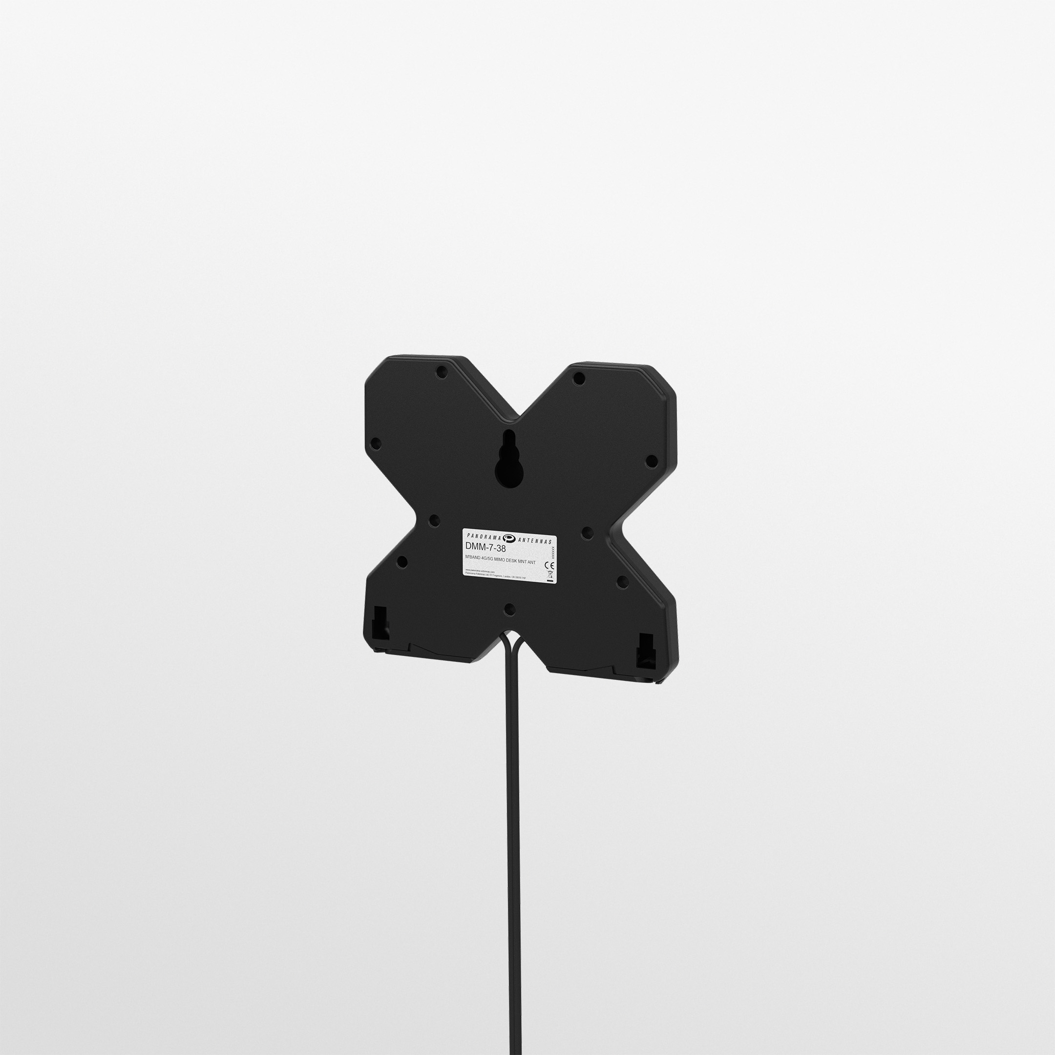 Black Panorama DMM-7-38-2SP compact X-shaped 4G/5G MIMO desk antenna on its feet with twin SMA cables. — view 4
