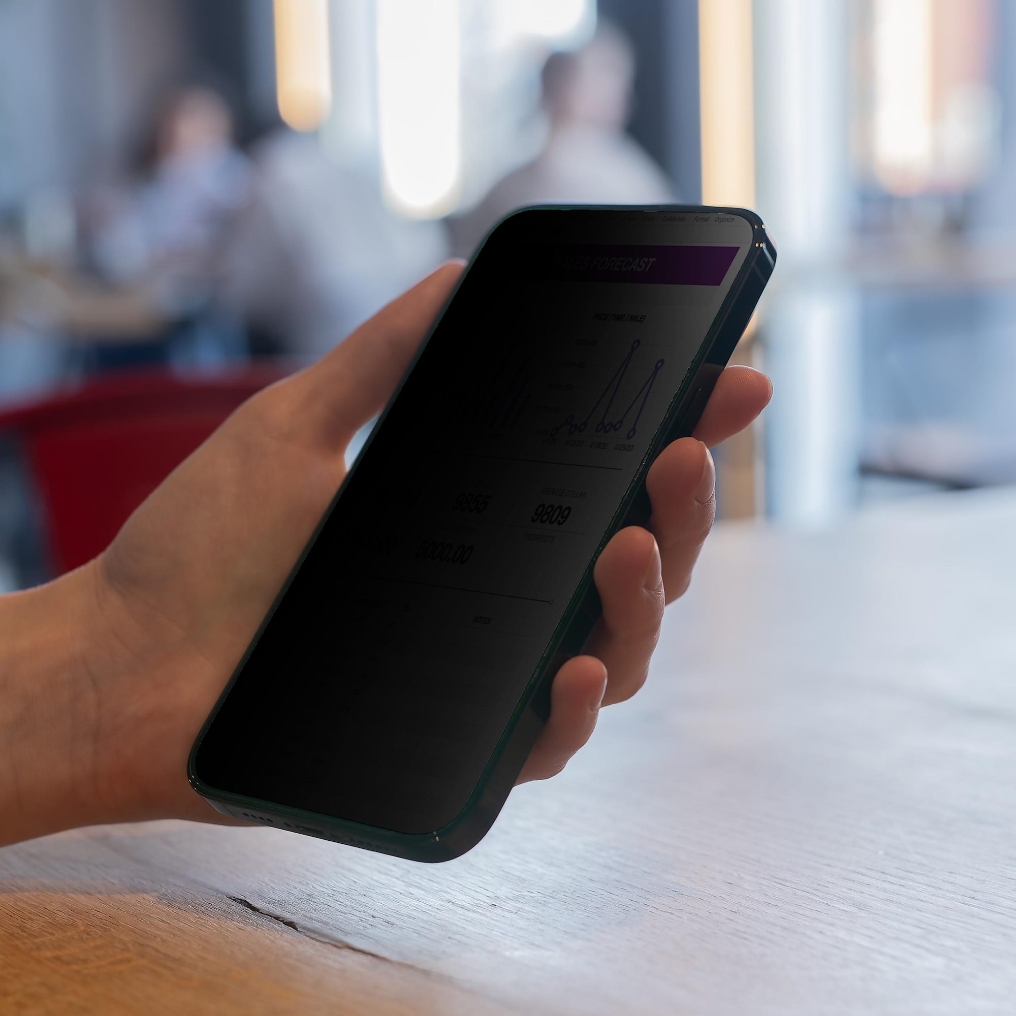StarTech.com 4-way tempered glass privacy screen protector shown on an iPhone 15 Pro Max. — view 10
