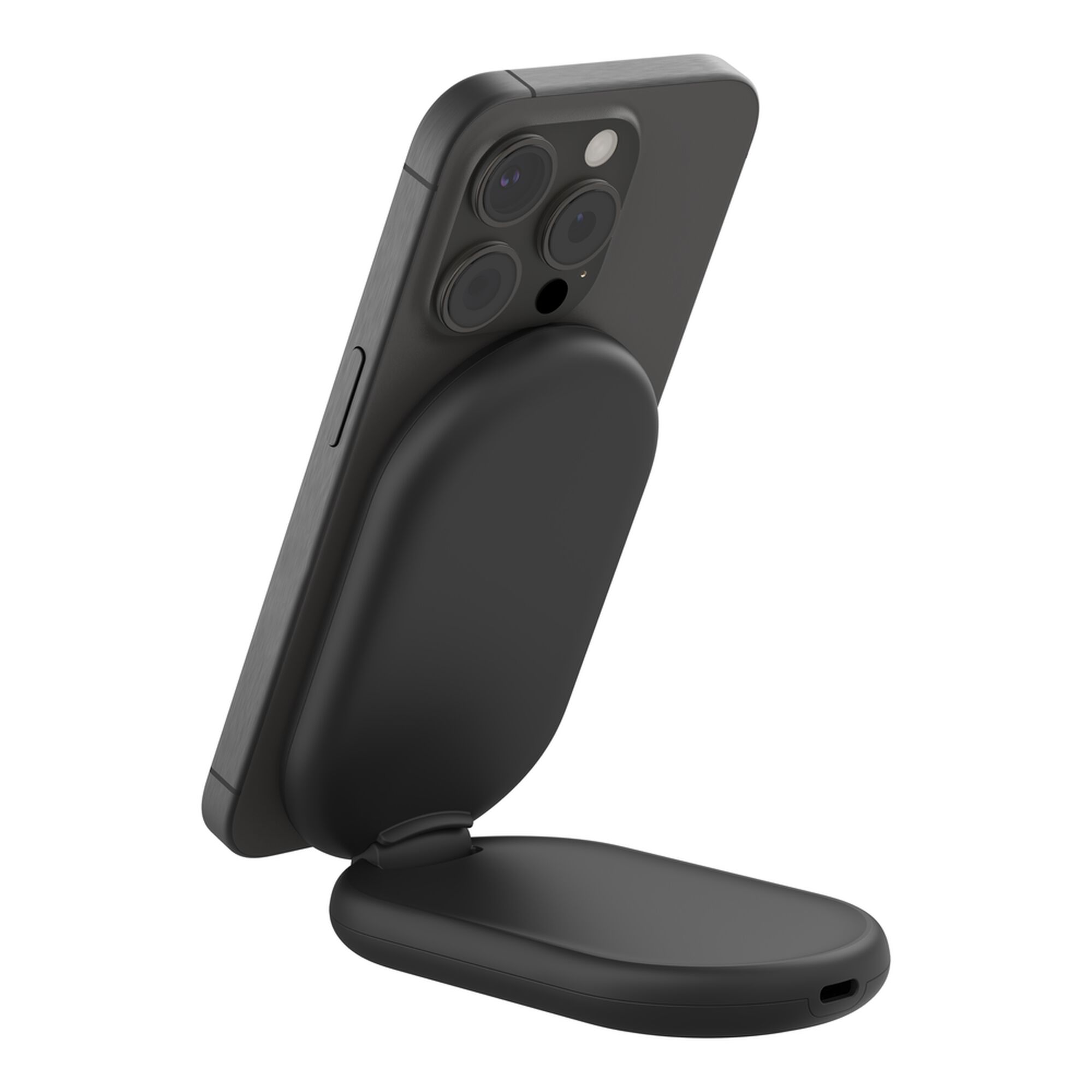 Black Belkin BoostCharge Qi2 15W magnetic foldable wireless charging stand holding an iPhone upright. — view 12