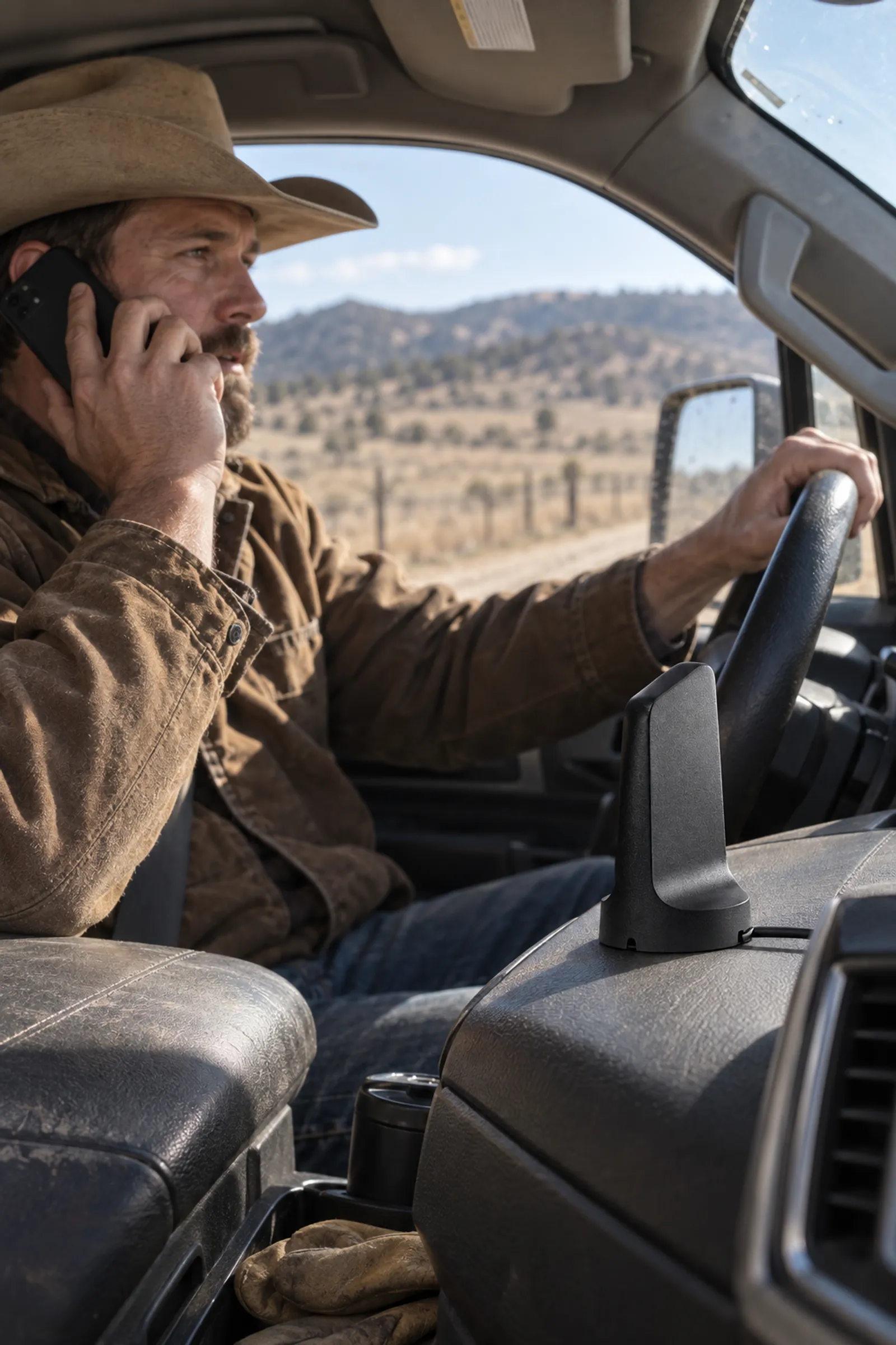 Rancher on a call with an in-vehicle booster